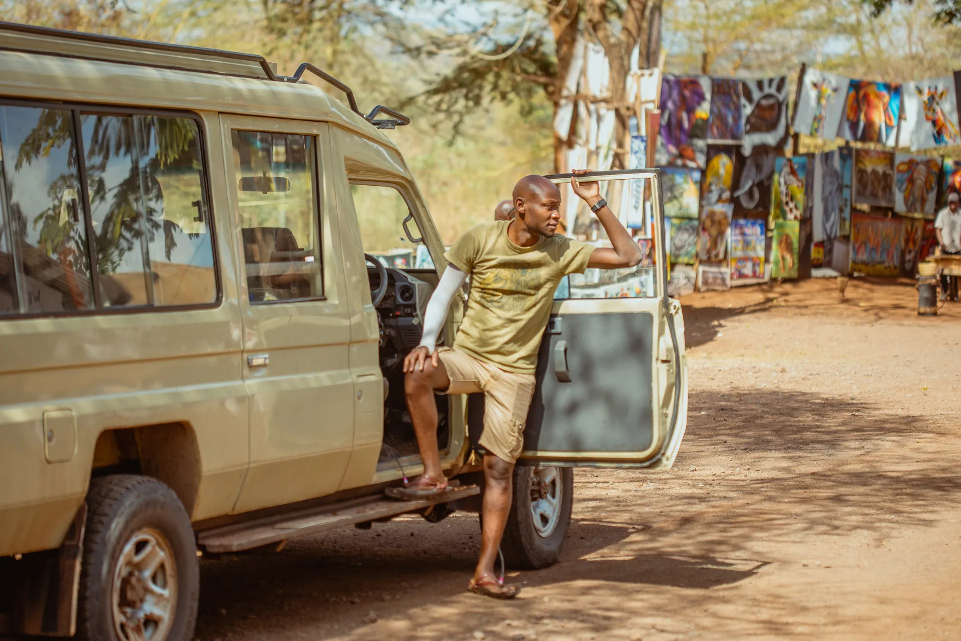 Safari vehicle travelling through a Tanzania wildlife area